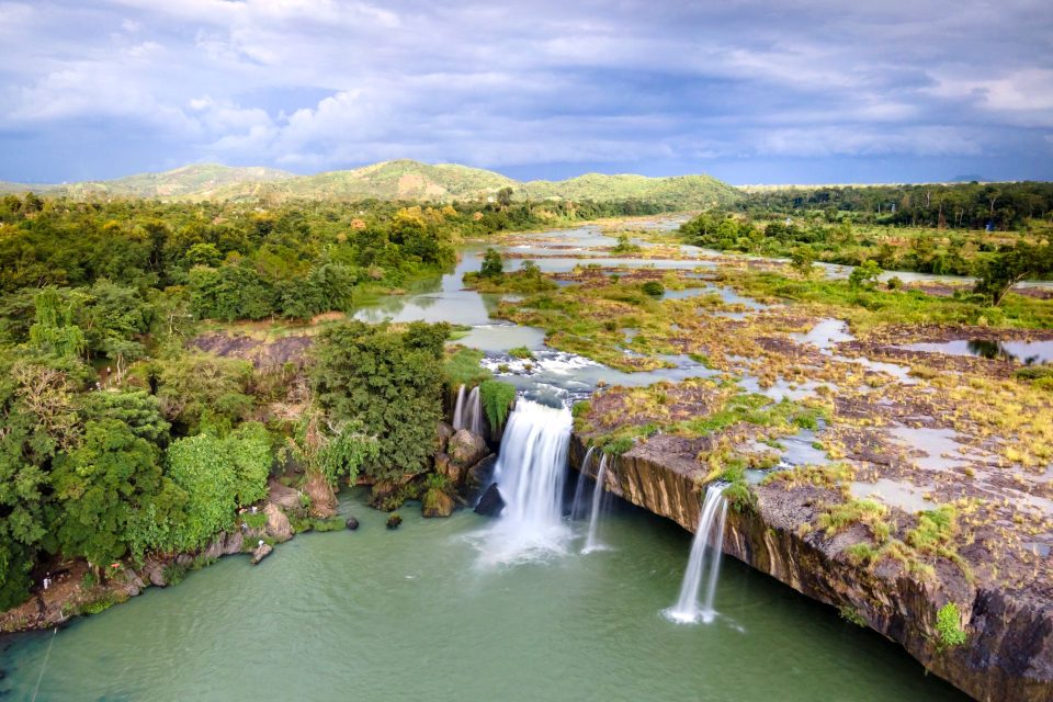 A breathtaking aerial view of Dray Nur Waterfall surrounded by lush greenery in Vietnam.