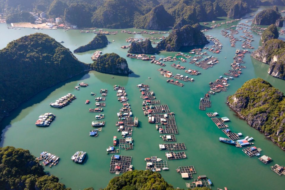 Stunning aerial view of floating fishing villages in Lan Ha Bay, Vietnam.