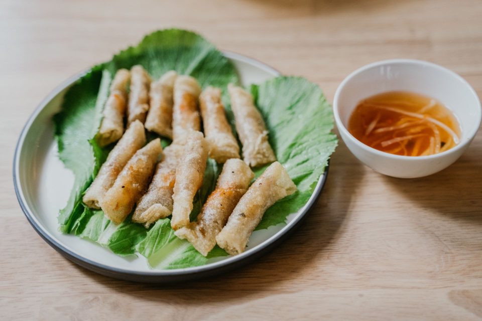Delicious Vietnamese spring rolls served on lettuce with tangy dipping sauce.
