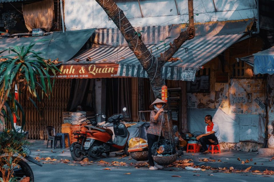 Vibrant street market in Hanoi, Vietnam showcasing local life and traditional shops.