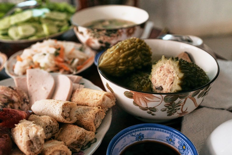 A sumptuous Vietnamese meal set for Tet with traditional dishes, showcasing vibrant culture.