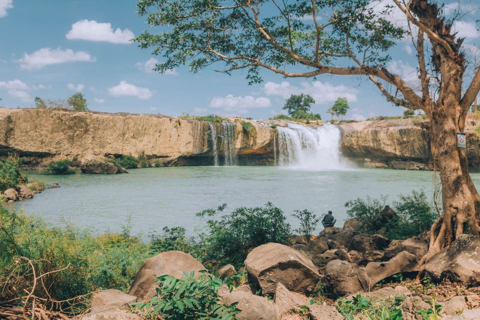 Beautiful landscape of Dray Sap waterfall surrounded by lush greenery in Đắk Lắk, Vietnam.